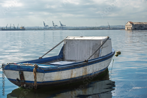Small Fishing Boat on Calm Water in Havana Bay, Cuba
