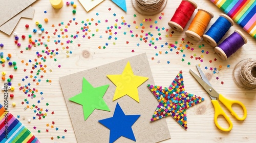 Crafting supplies with colorful paper stars and confetti on a wooden table