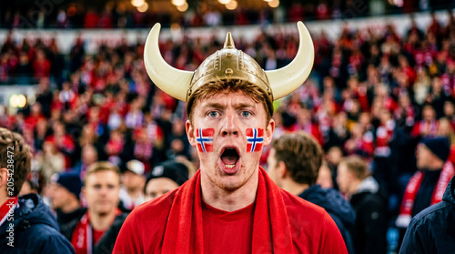 Norwegian male fan in viking helmet with flag face paint
