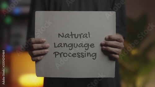 Natural Language Processing Written on Banner – Man Holding Placard