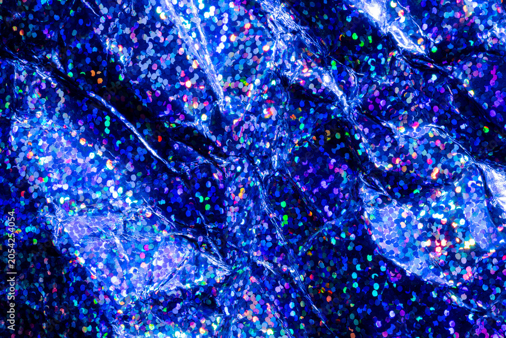 Obraz premium Blue holographic glitter texture with sparkling bokeh and crumpled metallic foil background