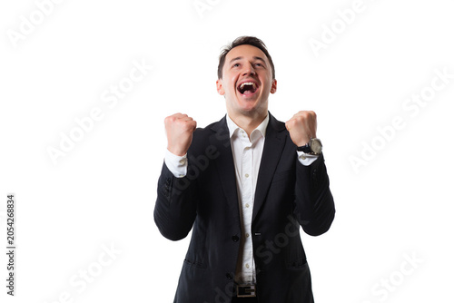 Excited businessman celebrating success with fists pumping