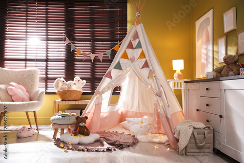 Schilderij op canvas Beautiful wigwam, cushions and toys in child's room