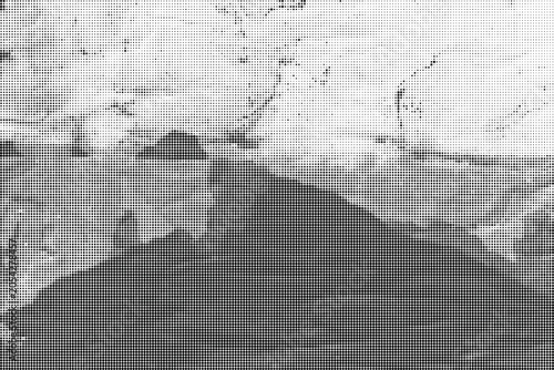 A dramatic landscape photo captures a dark mountain under a stormy sky with clouds.