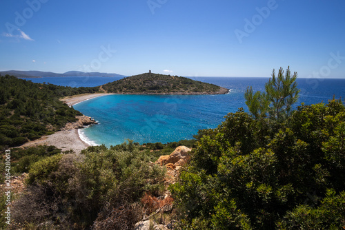 Trachili beach with wild herbs and white flowers in May, Aegean Sea, Chios, Greece, 