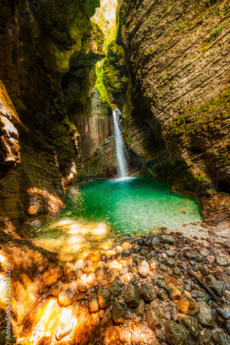 Quadro su tela Kozjak waterfall in Slovenian alps near soca river