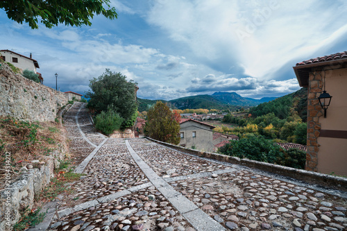 Cobblestone Street and Mountain View in Frias, Spain
