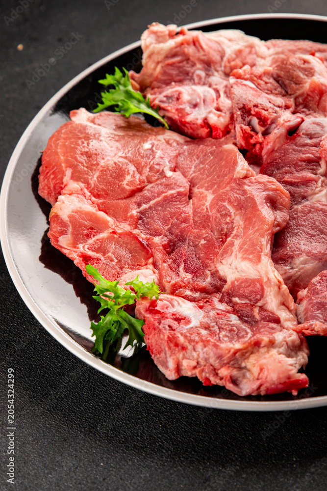 Obraz premium Raw pork steak pork tenderloin, food preparation lunch or dinner tasty organic snack fresh farm product delicious gourmet food background on the table rustic food, top view copy space