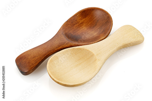 Small wooden spoon for spice isolated on white background. Close-up