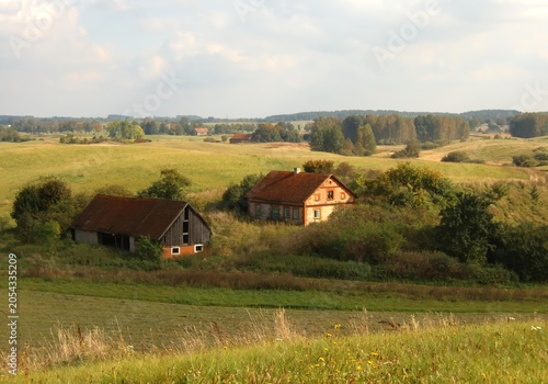 A rural autumn landscape with an old farmhouse. A view reminiscent of a Bruegel painting.