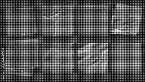 Obraz na płótnie A collection of crumpled paper sheets arranged in a grid on a dark surface for display