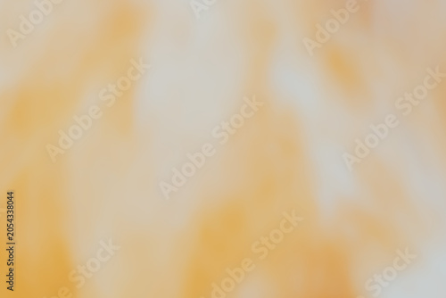 Orange yellow texture in pastel tones. Blurred yellow texture