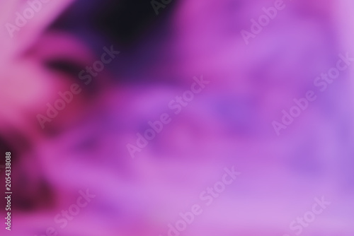 Purple-pink haze texture. Abstract blurred smoke background in pink tones