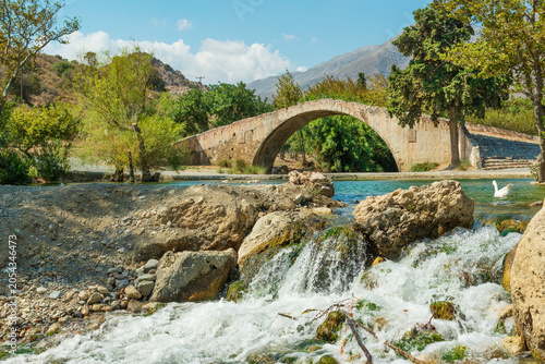 Historic Preveli (Venetian) stone arched bridge built around 1750 and spans the Kourtaliotis (or Megalopotamos) river near famous Preveli monastery in Crete, Greece