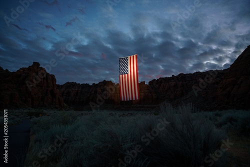 Giant American Flag Hanging Between Red Rock Desert Cliffs at Sunset in Utah to Celebrate the Patriotic America 250 Celebration for 4th of July 04