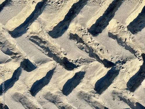 Tire tracks on the sand on the beach in the morning in Wildwood, New Jersey