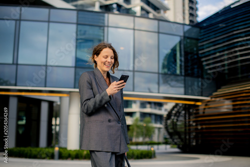 Businesswoman smiles while ...
