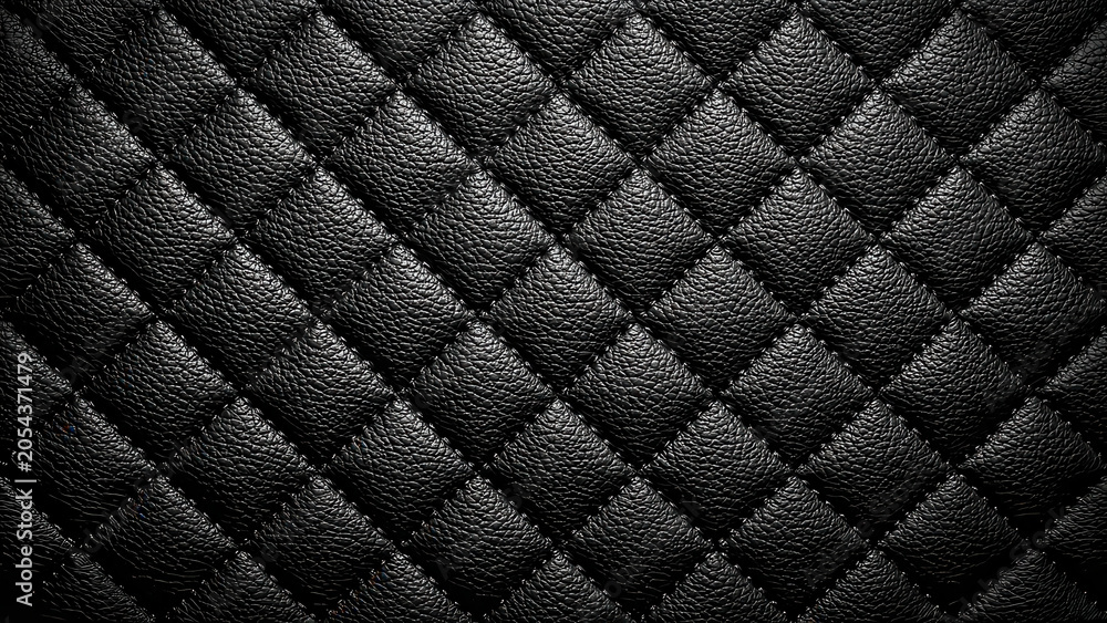 Fototapeta premium A detailed view of black quilted leather, showcasing its luxurious texture and elegant pattern, often used in high-end design.