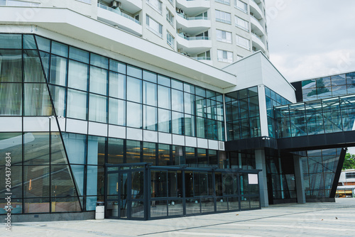 Принти на полотні Modern building with glass facade located in an urban area on a sunny day with f