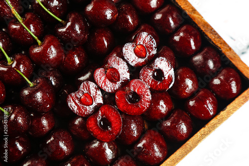 Εκτύπωση καμβά Fresh Red Cherries and Pitted Cherry Halves on Wooden Board - Premium Fruit Disp