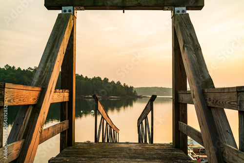 Wooden boardwalk on a river during golden hour