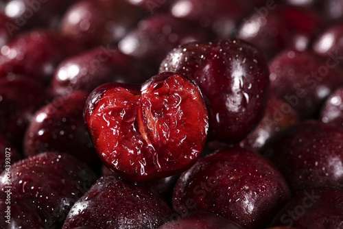Vászonkép Fresh Wet Cherries with Cut Cherry Showing Red Flesh - Premium Yantai Chile Impo