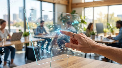 A woman collaborates on a futuristic touchscreen display in a bright, modern office environment.