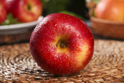 Принти на полотні Fresh Red Fuji Apple with Water Droplets from Shaanxi Highland Region on Wicker