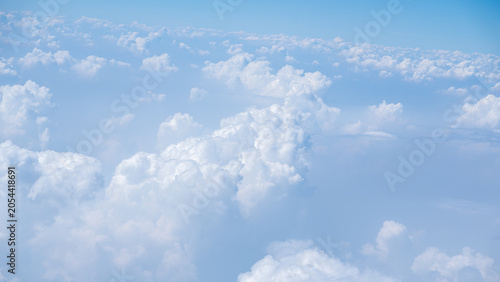 Foto Fluffy white cloud formation filling blue sky viewed from high altitude aerial p