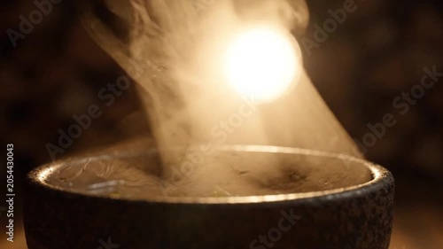 A video showcasing a smoky candle in a peaceful setting for relaxation and meditation