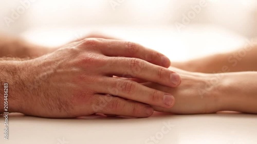 A heartwarming video shows a man and woman holding hands in a peaceful moment
