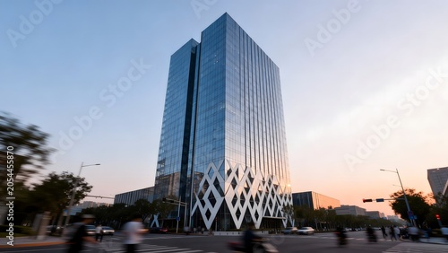 Modern glass skyscraper at sunset