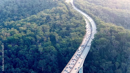 Purse bridge on Motorway One M1 in Australia aerial view of heavy holiday traffic jam.