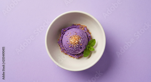 Ube ice cream scoop in a bowl