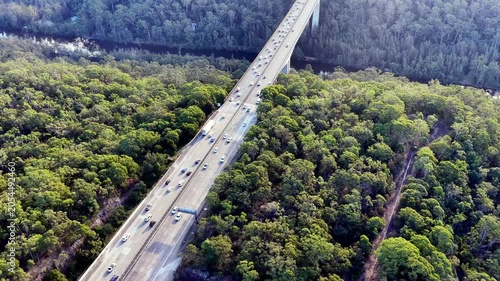 Back aerial flying over Motorway one holiday traffic jam in Australia heavy use of road.