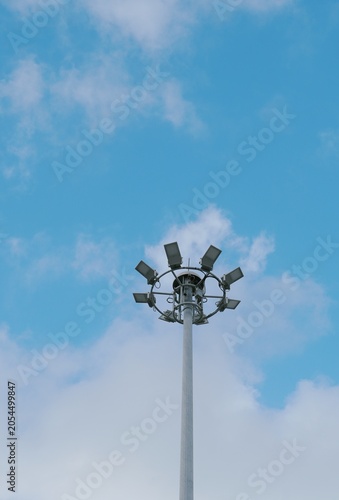 High mast pillars, sky backdrop.