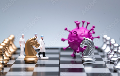 Foto Doctors and chess pieces confronting a virus on a chessboard