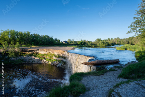 Scenic waterfall in the sunset light. Jagala Waterfall.