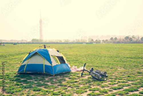 Принти на полотні Tents and BMX bikes on the lawn