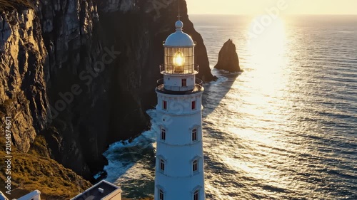 Aerial View Of The Majestic Beacon Standing Tall On Rugged Sea Cliffs
