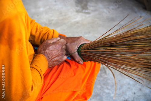 Traditional Thai handcrafted brooms made from coconut trees.