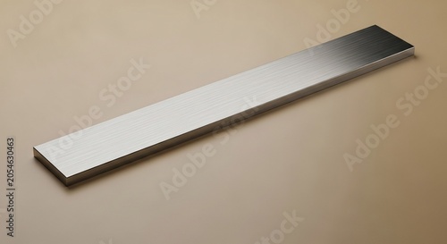 A single rectangular piece of polished stainless steel bar isolated on a neutral background.