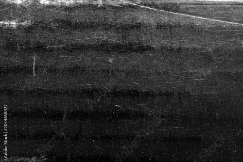 Foto Black scratched grunge texture background, distressed paper surface with white d