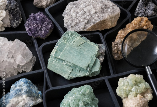 Canvastavla Assorted raw mineral crystals and gemstones arranged in a black tray with a magn