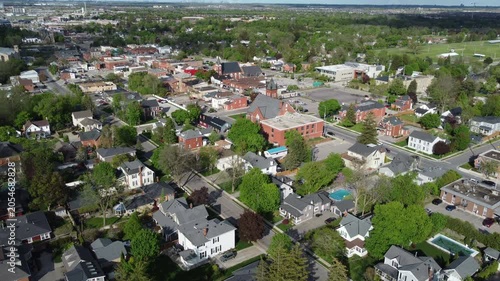 Aerial view of Milton, Ontario, Canada as shot from a drone on a mixed sunshine and clouds spring day in May, 2022. Hovering and then moving forward towards Main Street.