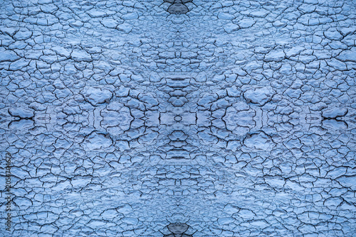 Quadro su tela A seamless natural texture of cracked clay in a light blue color, featuring a symmetrical and kaleidoscopic abstract pattern