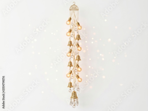 Decorative hanging light fixture with golden bells and crystal accents