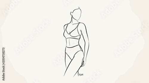 Woman in lingerie standing relaxed pose.