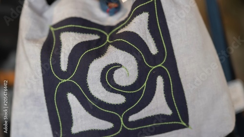 Принти на полотні Close up of traditional Ainu pattern embroidery on textile fabric, indigenous craft from Hokkaido, Japan