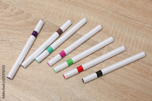 Set of colored felt-tip pens with white blank body on the table